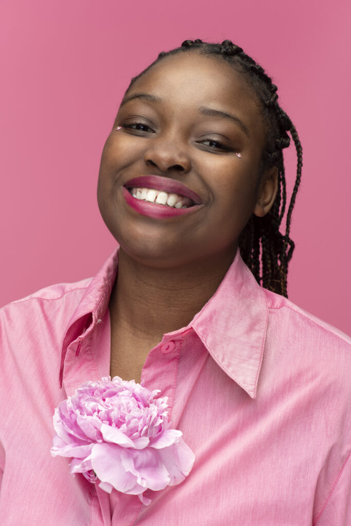 medium shot smiley woman with flower